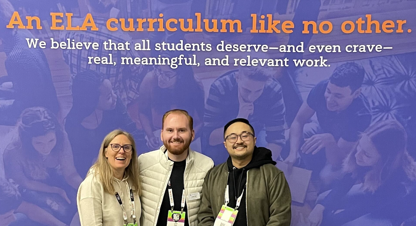 Three educators smiling in front of a banner that reads, 'An ELA curriculum like no other. We believe that all students deserve—and even crave—real, meaningful, and relevant work.' The background features a group of students engaged in collaborative learning.